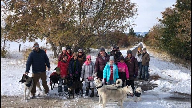Group of people and dogs in the snow